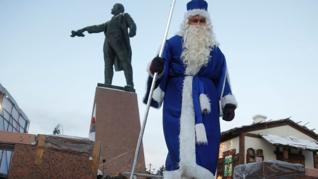 An actor plays Grandfather Frost during celebration of Orthodox Christmas in St.Petersburg, Russia.