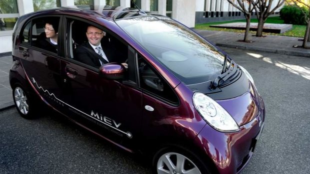 Happier days: ministers  Penny Wong and Anthony Albanese in an ecar.