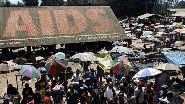 An AIDS public awareness campaign dominates the roof of Goroka's central market.