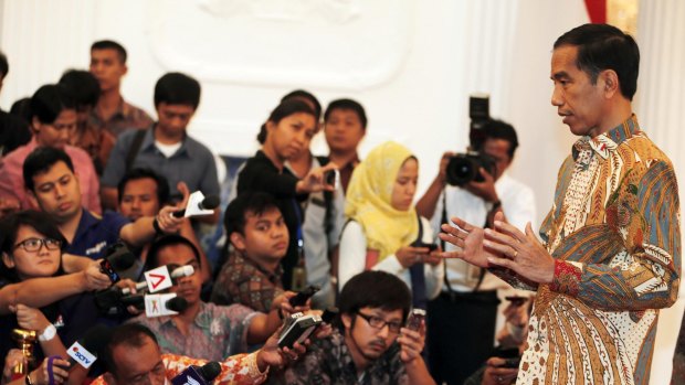 Joko Widodo talking to reporters last year. 