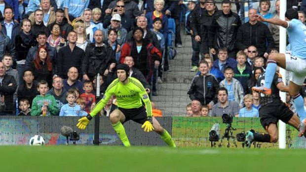 More Tevez torture . . . Manchester City's Carlos Tevez smashes the ball past Chelsea keeper Petr Cech for what proved to be the only goal of the game. It was Tevez's sixth goal in as many matches against Chelsea.