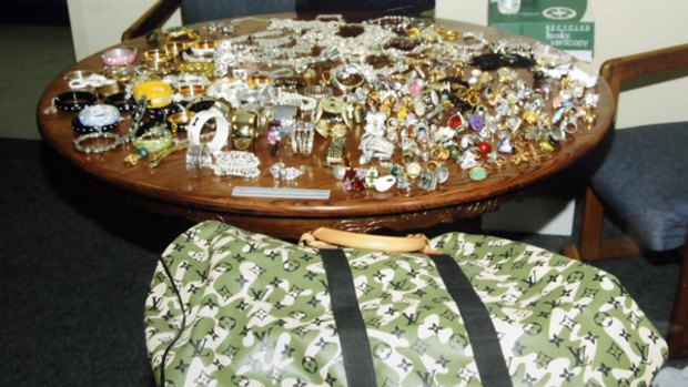This evidence photo provided by the Los Angeles Police Department shows jewellery and a Louis Vuitton bag taken from the home of Paris Hilton.