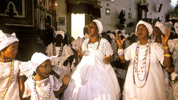 African flavour: Women celebrate the patron saint of Baiana do Acaraje in Pelorinho's church of Our Lady of the Rosaries.