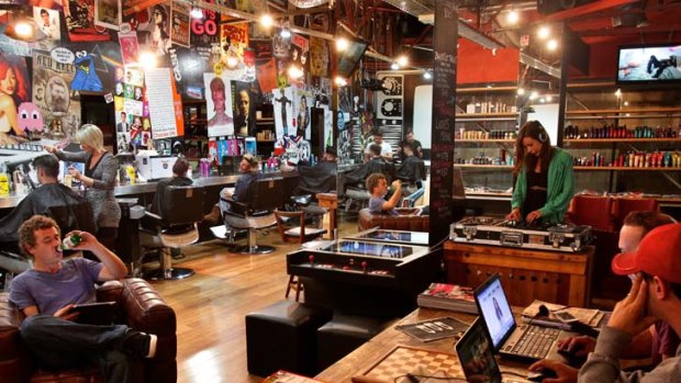 Sweet beats and hair styling ... Ziggy's Barber Salon in Darlinghurst supplies iPads, music and cold beer to draw in customers and provide a space for them to hang out because ''business is tough out there'', owner David Rosenberg says.