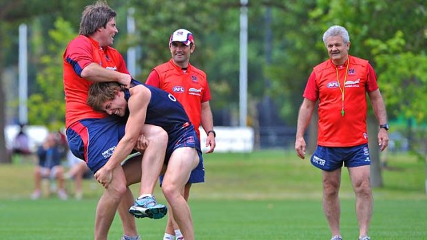 New Demon: Draft recruit Jack Viney tries a tackle on Leigh Brown at Melbourne training.