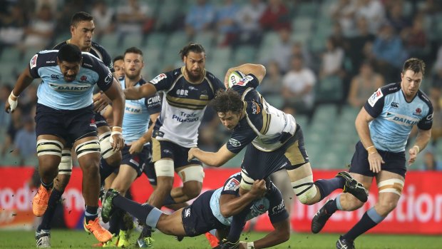 Last-ditch tackle: Brumbies skipper Sam Carter finds a half gap against the Waratahs.