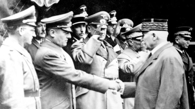 Otto Abetz shakes hands with Vichy leader Marshal Philippe Petain in 1941.