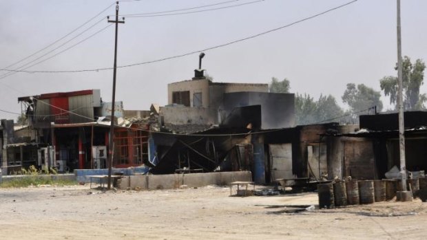 Burnt-out shops after clashes between Iraqi security forces and ISIL militants in Baquba.