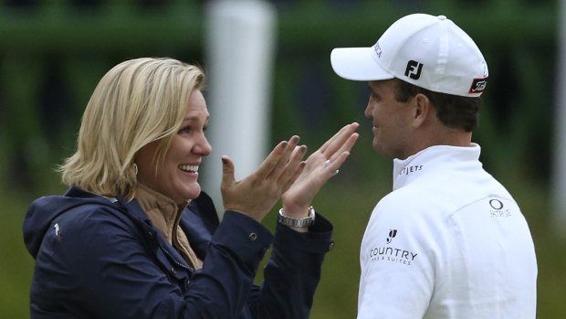 Kim Barclay congratulates husband Zach Johnson on his British Open victory at St Andrews yesterday.