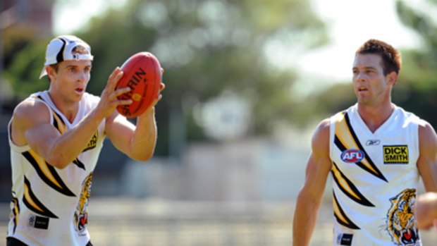 Ben Cousins (right) with Richmond's young midfielder Brett Deledio.