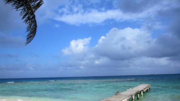 Sandy Cay, one of two unbelievably affordable private islands for rent off the coast of Utila, itself a tiny island about 30kms from mainland Honduras.