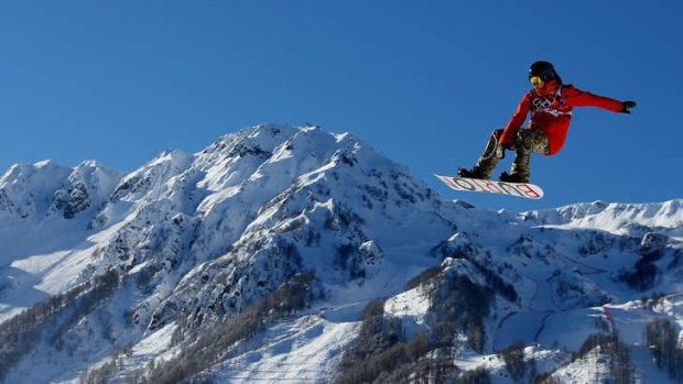 Flying high: A rider trains for the snowboard slopestyle at Rosa Khutor Extreme Park.