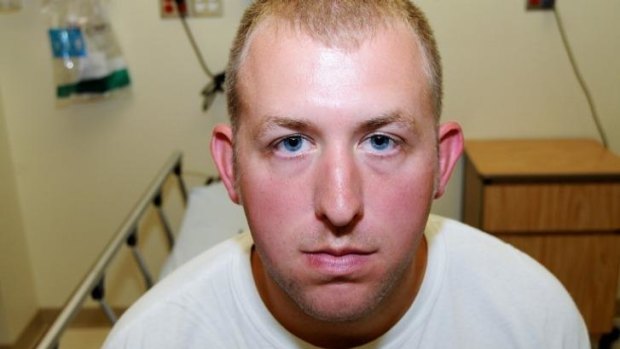 An undated photo shows police officer Darren Wilson shortly after he fatally shot black teenager Michael Brown, and used as an evidence by the grand jury.