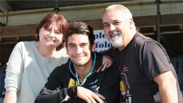 Close-knit: Port Adelaide star Chad Wingard with his parents, Julie and Trevor.
