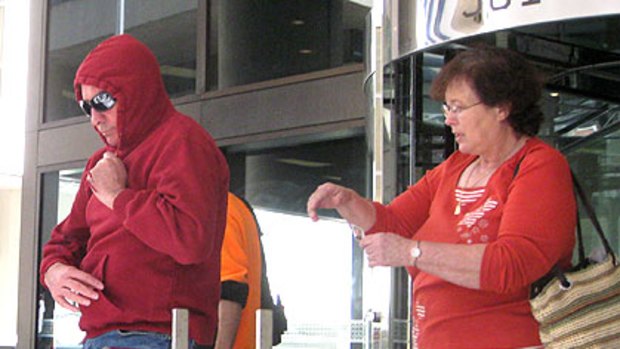 Dennis McKenna is confronted as he leaves Perth Magistrates Court earlier this year.