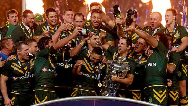 Australia captain Cameron Smith holds the World Cup as he celebrates with teammates.