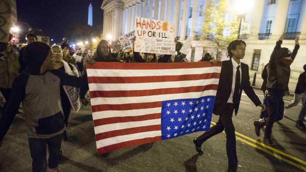 Race crisis in America ... Demonstrators rally against the grand jury decision in Washington.