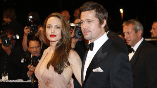 Secretly miserable? ... Angelina Jolie and Brad Pitt.