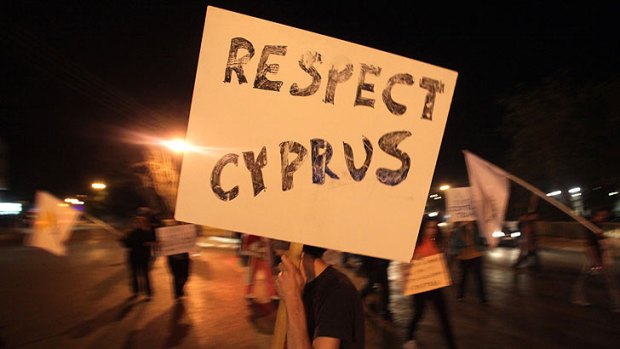 "Respect Cyprus" ... a Cypriot man holds a sign during a demonstration in Nicosia.