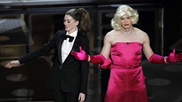 Hathaway goes 'the enthusiastic route' next to Franco dressed as Marylin.