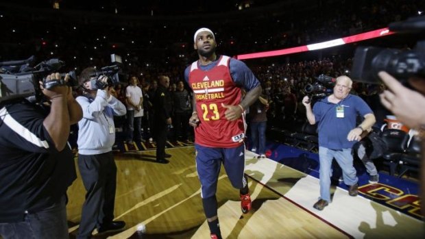 Top of the pile: LeBron James runs out at Cleveland's scrimmage this week.
