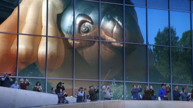 Crowds watch the launch of former Canberra artist Patricia Piccinini's work Skywhale at the National Gallery of Australia.