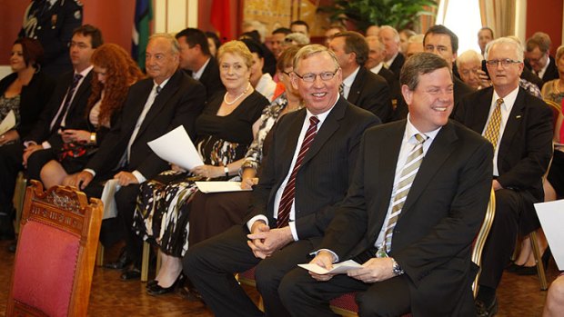 Jeff Seeney and Tim Nicholls watch as Campbell Newman is sworn in as Premier.