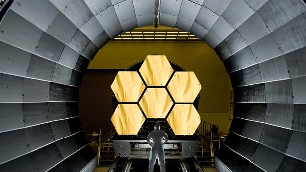 NASA engineer Ernie Wright looks on as the first six flight ready James Webb Space Telescope's primary mirror segments are prepped to begin final cryogenic testing at NASA's Marshall Space Flight Centre.