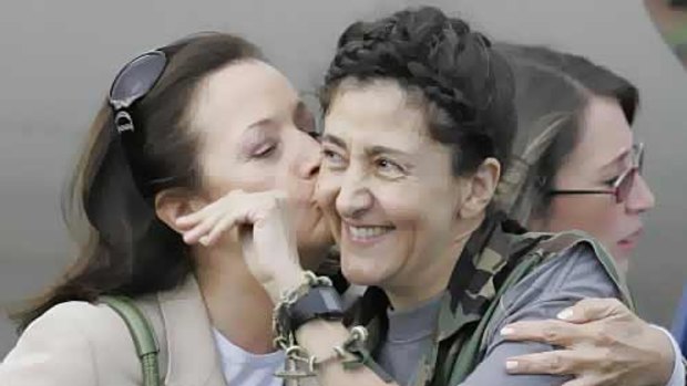 Freed after six years ... former hostage Ingrid Betancourt (right) is kissed by her mother, Yolanda Pulecio. 