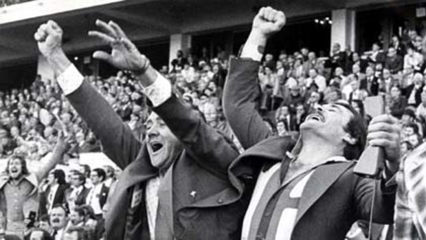 Final siren and joy for North Melbourne coach Ron Barassi and selector John Wymer after winning the 1977 grand final replay.