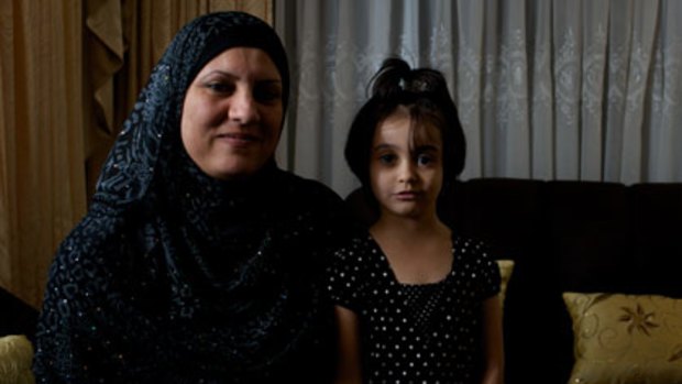 ``I thought it [would be like a cruise]'' ...Entisar Alsaady and her daughter Sarah, 4, at their Bonnyrigg Heights home.