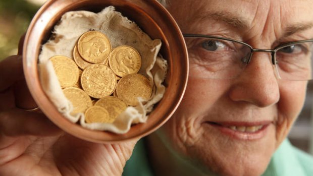 Trudi Blessing with the coins from Lawrence of Arabia.