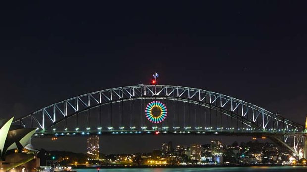 Isn't she pretty ... the light show test on the Harbour Bridge. Thousands of aerial shells and comets will be released from the bridge, barges and rooftops before an expected worldwide audience of 1 billion.