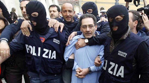 "Extraordinary success" ... police pose with Mario Caterino.