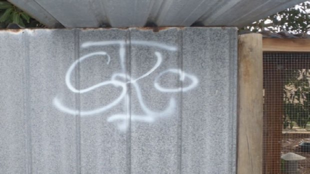 This is the graffiti tag left by the gang.