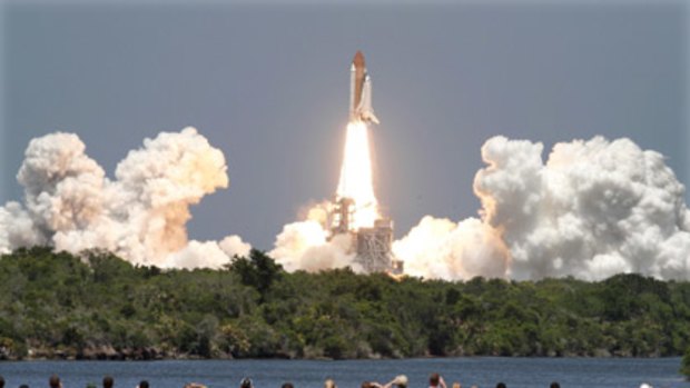 Final countdown... space shuttle Atlantis lifts off from the Kennedy Space Centre in Florida for the last time yesterday.