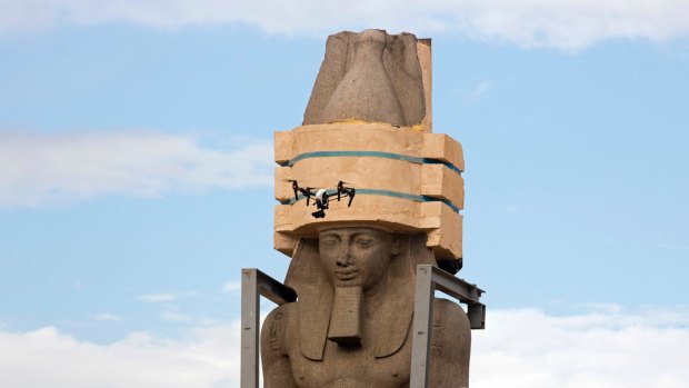 A drone films the giant statue of the pharaoh Ramses II as it is relocated to the Grand Egyptian Museum, in Cairo, Egypt.