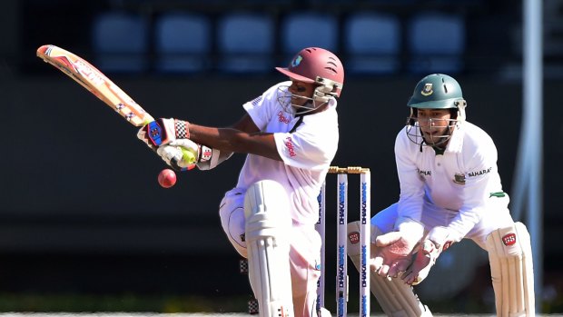 Shaky future: West Indies batsman Shivnarine Chanderpaul goes for a sweep against Bangladesh in September.