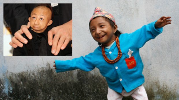 Khagendra Thapa Magar and (inset) the world's smallest man He Pingping.