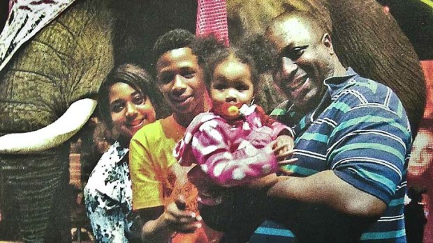 Family man: Questions raised over the tactics used by New York police to bring down a 1.9 metre, 159kg Eric Garner, seen her with some of his children.
