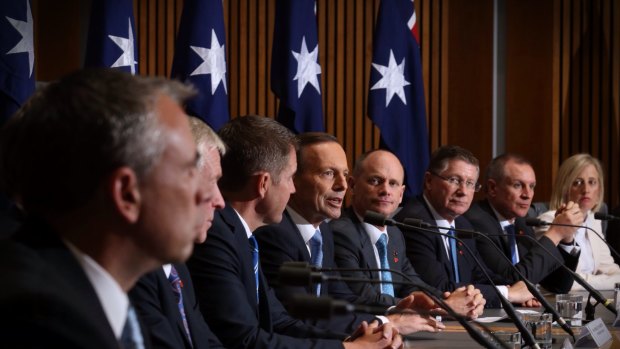 Prime Minister Tony Abbott, centre, with state premiers and territory chief ministers after COAG in Parliament House in Canberra.