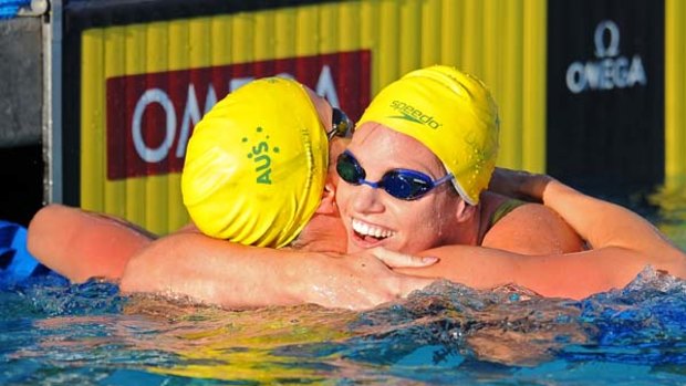 Australia's Marieke Gurehrer (L) celebrates with teammate Emily Seebohm (R) after Gurehrer won the womens 50m butterfly final. Seebohm went on to win the 100m backstroke gold medal.