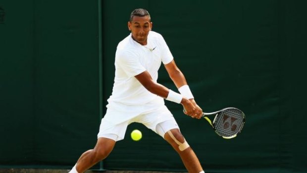 Love the green stuff: Nick Kyrgios belts a backhand in his win over Stephane Robert.