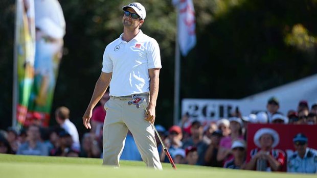 Adam Scott reacts after missing a putt on the 18th green in the final round of the Australian Open.