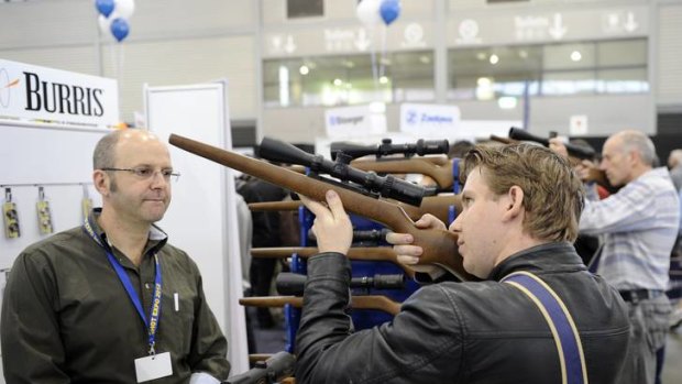 Firepower ... enthusiasts at the Sydney gun show at Homebush yesterday.