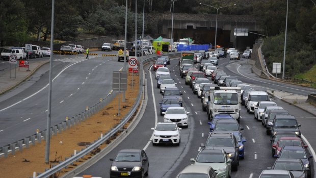 Heavy traffic on Parkes Way after the Acton tunnel crash in 2015: Infrastructure Australia says the ACT needs to build public transport capacity east to west. Photo: Jay Cronan