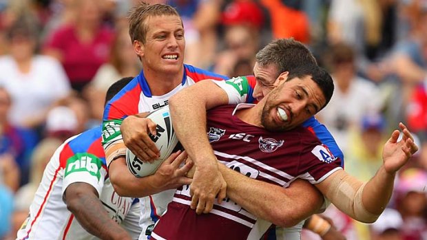 Brent Kite of the Sea Eagles is tackled during the match with the Knights.