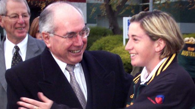 As a teenager with former prime minister John Howard.