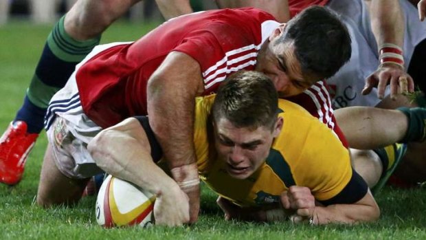 Gold fingers: James O’Connor plants the ball for the Wallabies’ only try.