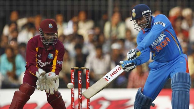 Man on fire &#8230; India opener Virender Sehwag swings the bat during his record 219 against West Indies in their one-day international last Thursday.